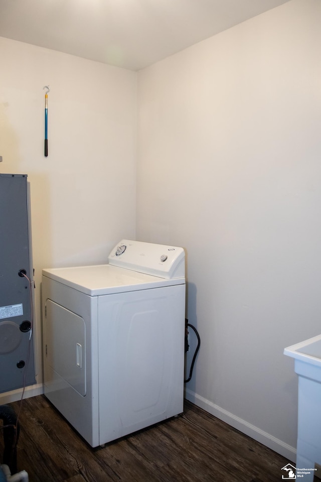 25095 Darin St, Taylor, MI 48180 - laundry area featuring washer / dryer and dark wood-style floors