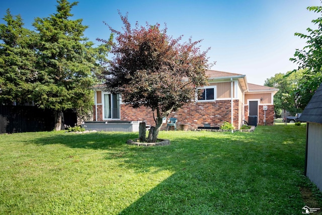 25095 Darin St, Taylor, MI 48180 - back of property with a lawn and brick siding