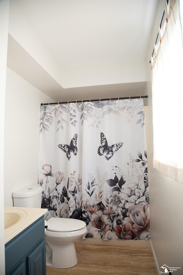 25095 Darin St, Taylor, MI 48180 - full bathroom with wood finished floors, vanity, and curtained shower