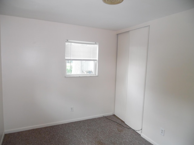 954 Concord Blvd, Jackson, MI 49202 - carpeted empty room featuring baseboards