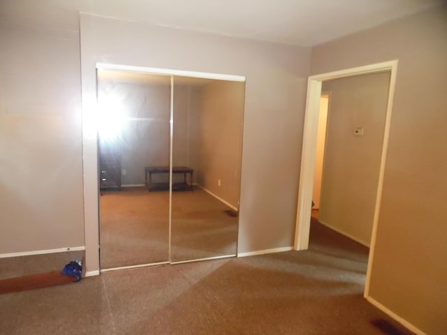 954 Concord Blvd, Jackson, MI 49202 - unfurnished bedroom featuring carpet flooring and a closet