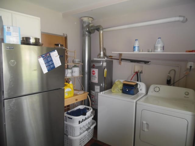954 Concord Blvd, Jackson, MI 49202 - washroom with water heater and washer and dryer