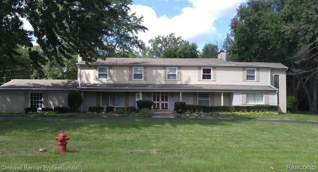 29585 Woodhaven Ln, Southfield, MI 48076 - traditional home featuring a front yard and a chimney