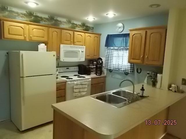3894 Vandekarr Rd, Owosso, MI 48867 - kitchen featuring white appliances, a peninsula, light brown cabinets, and light countertops