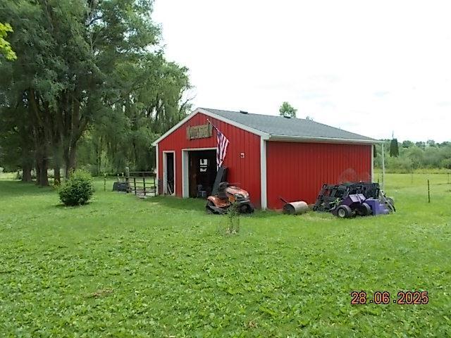 3894 Vandekarr Rd, Owosso, MI 48867 - view of pole building featuring a lawn
