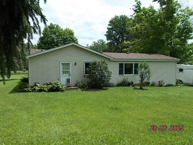 3894 Vandekarr Rd, Owosso, MI 48867 - back of house with a yard