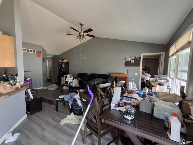 3017 3rd St, Monroe, MI 48162 - dining space with wood finished floors, ceiling fan, and vaulted ceiling