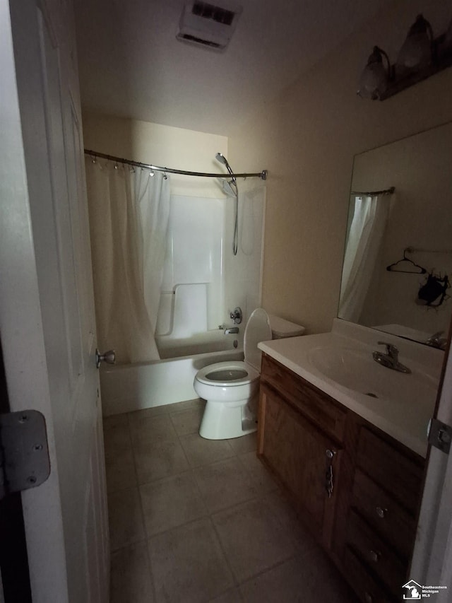 3017 3rd St, Monroe, MI 48162 - bathroom featuring shower / bath combo with shower curtain, vanity, and tile patterned floors