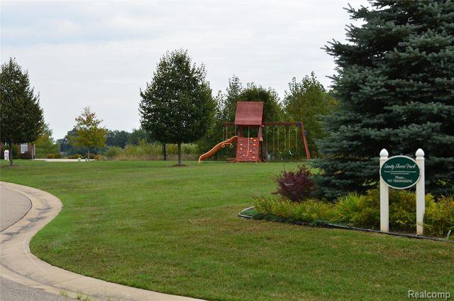 1974 Sandy Shores Dr, Oxford, MI 48371 - community play area with a lawn