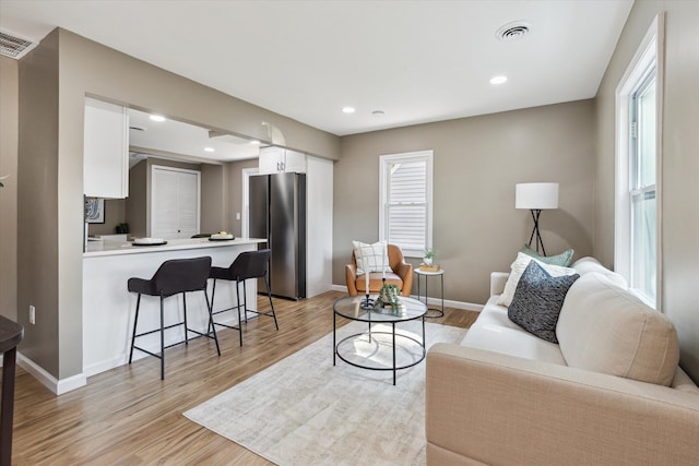 233 Outer Ln, Ypsilanti, MI 48198 - living area featuring light wood finished floors and recessed lighting