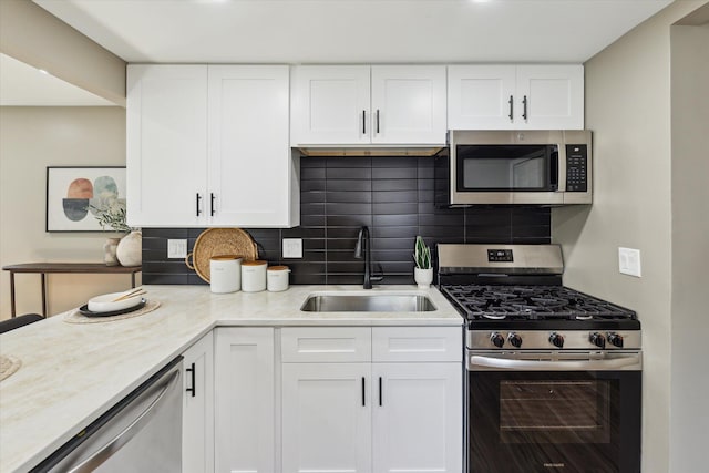 233 Outer Ln, Ypsilanti, MI 48198 - kitchen featuring stainless steel appliances, white cabinetry, and tasteful backsplash