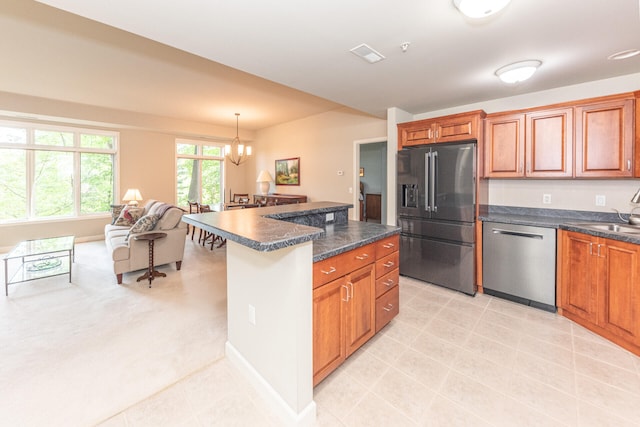 827 Asa Gray Dr Unit 257, Ann Arbor, MI 48105 - kitchen featuring fridge with ice dispenser, stainless steel dishwasher, dark countertops, and brown cabinetry