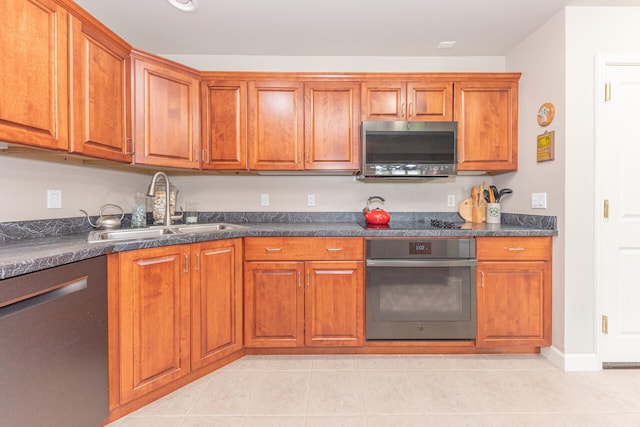 827 Asa Gray Dr Unit 257, Ann Arbor, MI 48105 - kitchen with stainless steel appliances, dark countertops, and brown cabinets