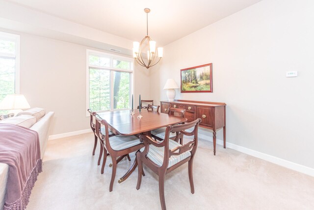 827 Asa Gray Dr Unit 257, Ann Arbor, MI 48105 - dining area featuring a chandelier and light colored carpet