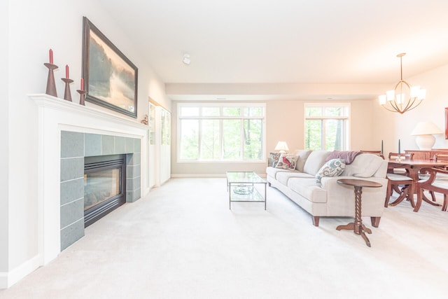 827 Asa Gray Dr Unit 257, Ann Arbor, MI 48105 - carpeted living area featuring a chandelier and a fireplace