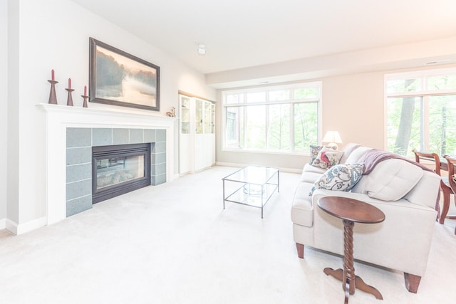 827 Asa Gray Dr Unit 257, Ann Arbor, MI 48105 - living area with carpet and a tiled fireplace