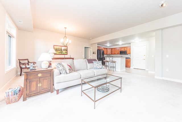 827 Asa Gray Dr Unit 257, Ann Arbor, MI 48105 - living room featuring a chandelier and light carpet