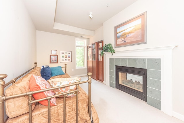 827 Asa Gray Dr Unit 257, Ann Arbor, MI 48105 - carpeted bedroom featuring a tile fireplace and access to exterior