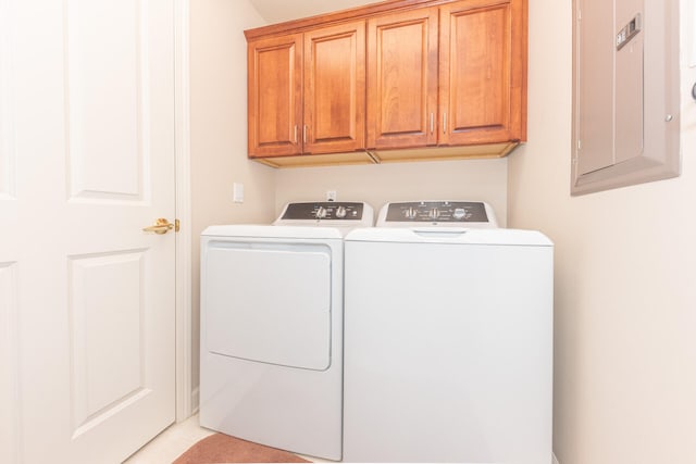 827 Asa Gray Dr Unit 257, Ann Arbor, MI 48105 - laundry area featuring washing machine and clothes dryer, cabinet space, electric panel, and light tile patterned flooring