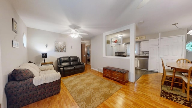 16035 Walnut St, Buchanan, MI 49107 - living area with ceiling fan, light wood-style flooring, and healthy amount of natural light