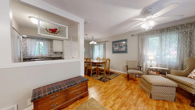 16035 Walnut St, Buchanan, MI 49107 - living area with light wood-style flooring and a ceiling fan