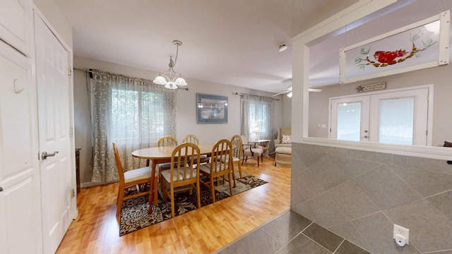 16035 Walnut St, Buchanan, MI 49107 - dining area featuring plenty of natural light, a chandelier, french doors, and a ceiling fan