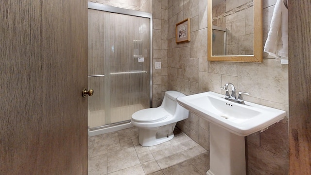 16035 Walnut St, Buchanan, MI 49107 - bathroom featuring tile walls, a stall shower, tile patterned floors, and backsplash