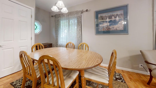 16035 Walnut St, Buchanan, MI 49107 - dining area featuring light wood-style floors and a chandelier