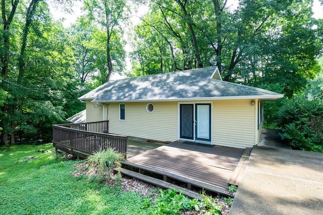 16035 Walnut St, Buchanan, MI 49107 - rear view of property featuring a wooden deck, a shingled roof, and a yard