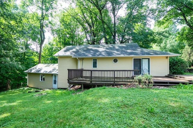 16035 Walnut St, Buchanan, MI 49107 - view of front of home featuring a deck, a front lawn, and roof with shingles