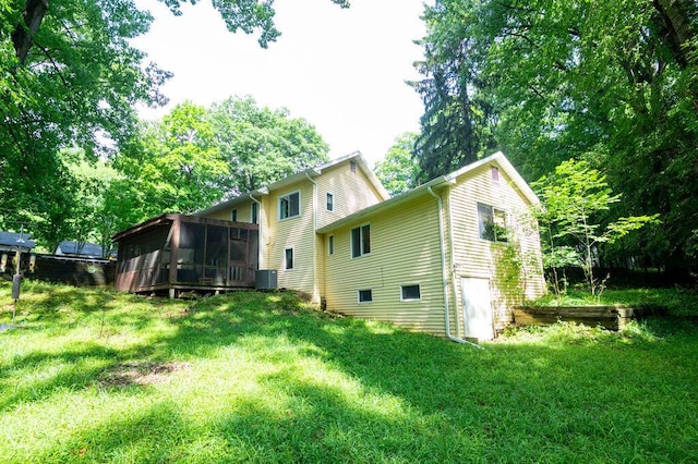 16035 Walnut St, Buchanan, MI 49107 - back of property with a sunroom and a yard