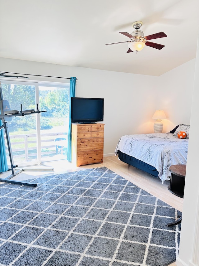2540 Forrester Rd, Frankfort, MI 49635 - bedroom with wood finished floors and a ceiling fan
