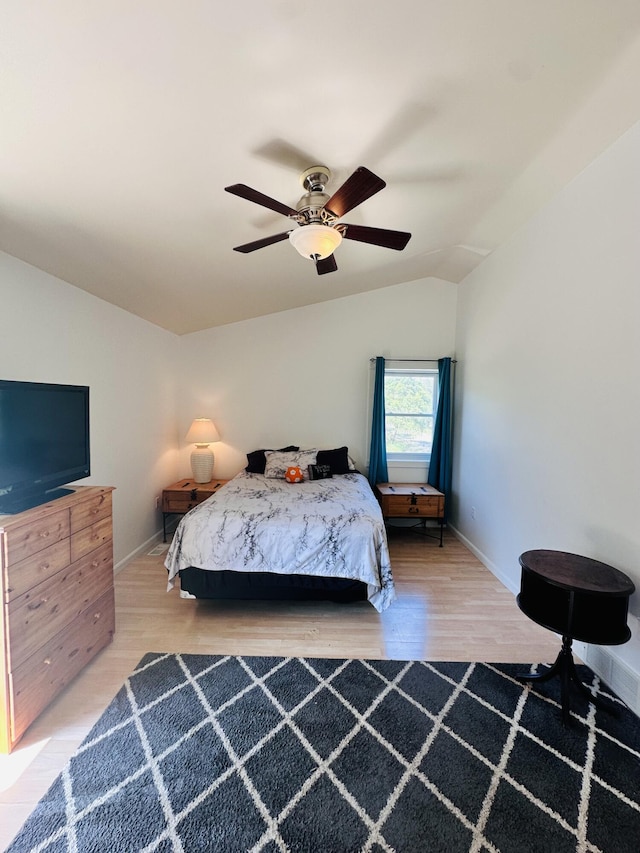 2540 Forrester Rd, Frankfort, MI 49635 - bedroom with lofted ceiling, wood finished floors, and a ceiling fan