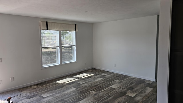 57907 James, Three Rivers, MI 49093 - spare room featuring dark wood finished floors and a textured ceiling
