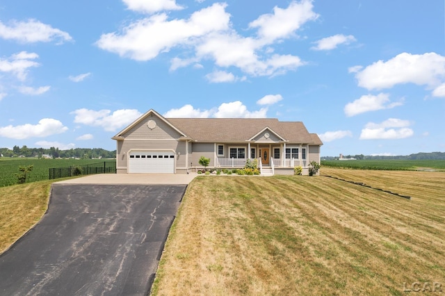 5726 Wolf Creek Hwy, Adrian, MI 49221 - ranch-style house featuring covered porch, asphalt driveway, an attached garage, and a front yard