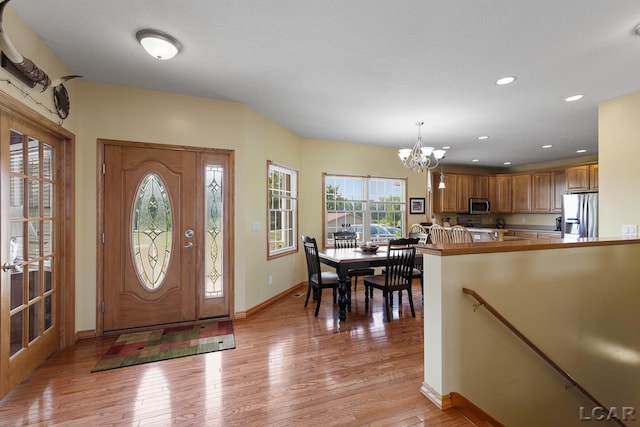 5726 Wolf Creek Hwy, Adrian, MI 49221 - foyer with a chandelier, light wood-style flooring, and recessed lighting