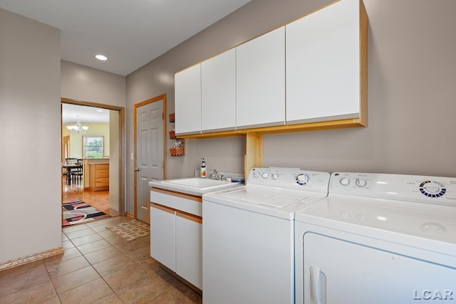 5726 Wolf Creek Hwy, Adrian, MI 49221 - laundry area featuring cabinet space, washer and clothes dryer, a chandelier, recessed lighting, and light tile patterned floors