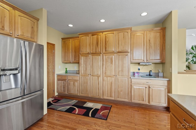 5726 Wolf Creek Hwy, Adrian, MI 49221 - kitchen featuring stainless steel fridge with ice dispenser, light wood finished floors, light countertops, and recessed lighting