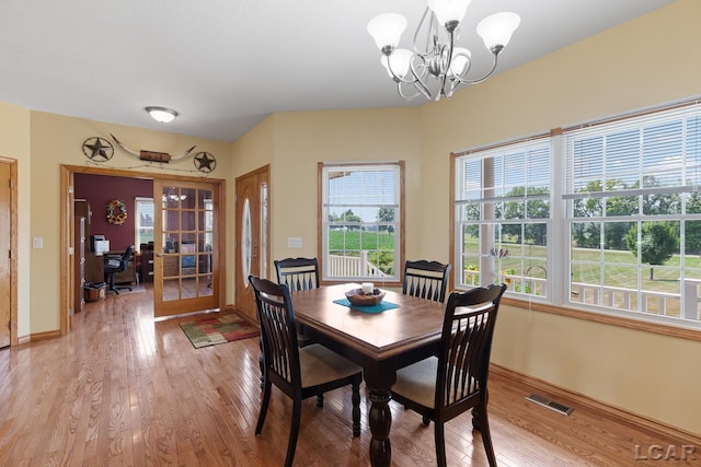 5726 Wolf Creek Hwy, Adrian, MI 49221 - dining room featuring light wood-style flooring, french doors, a chandelier, and an office area