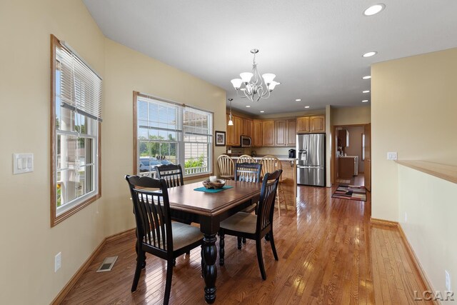 5726 Wolf Creek Hwy, Adrian, MI 49221 - dining room with a chandelier, light wood-type flooring, and recessed lighting