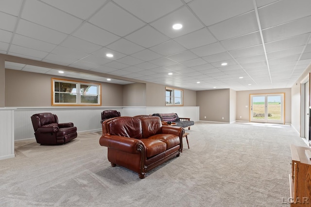5726 Wolf Creek Hwy, Adrian, MI 49221 - carpeted living area featuring a wainscoted wall, healthy amount of natural light, and a paneled ceiling