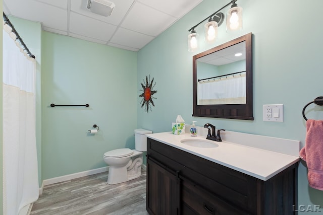 5726 Wolf Creek Hwy, Adrian, MI 49221 - bathroom featuring vanity, wood finished floors, and a drop ceiling
