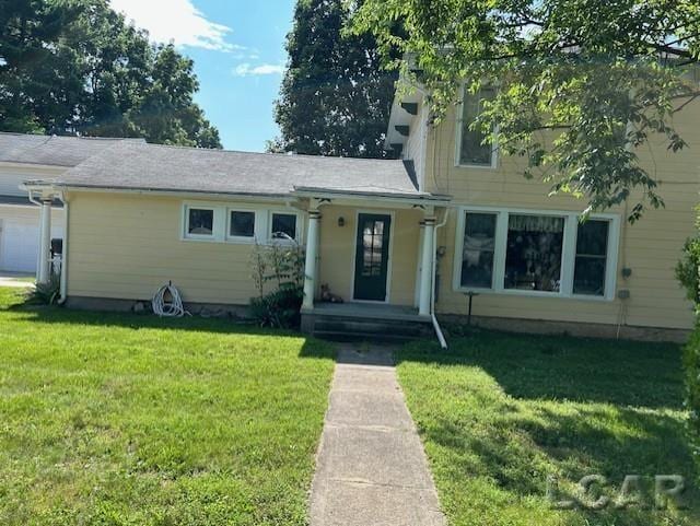 114 E Pottawatamie St, Tecumseh, MI 49286 - view of front of house with a front lawn