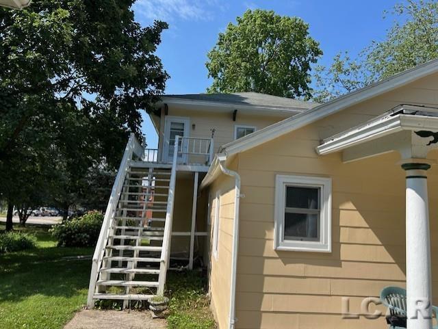 114 E Pottawatamie St, Tecumseh, MI 49286 - back of property with stairway and a yard
