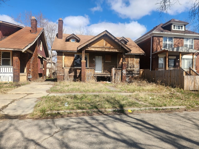 3226 Columbus St, Detroit, MI 48206 - view of front of home featuring covered porch and concrete driveway