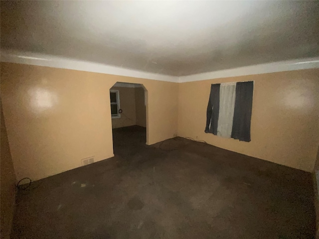 18905 Evergreen Rd, Detroit, MI 48219 - spare room featuring arched walkways and carpet flooring