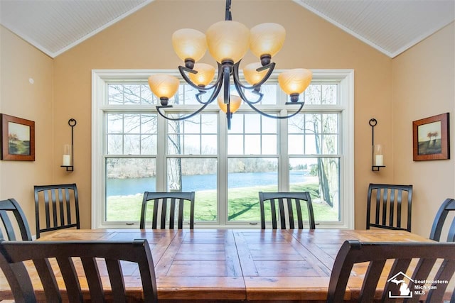 dining room with a chandelier and lofted ceiling