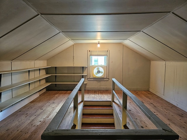 bonus room featuring wood-type flooring and vaulted ceiling