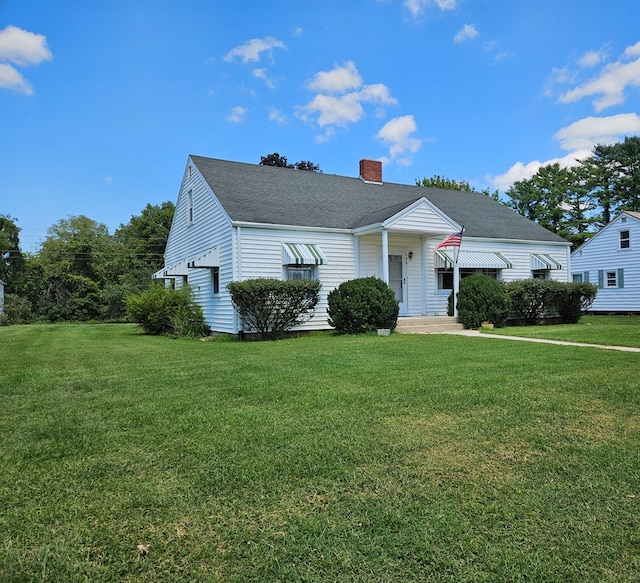 bungalow-style home with a front lawn