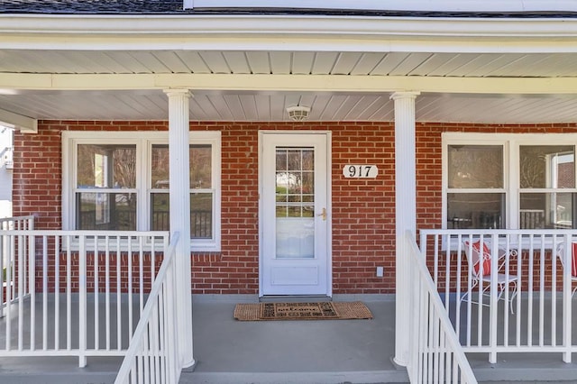 entrance to property featuring covered porch